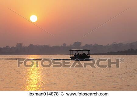 "Sunrise, safari boat on Kabini reservoir, Rajiv Gandhi National Park, Nagarhole National Park, Karnataka, South India, India, South Asia, Asia" View Large Photo Image Stock Image - "Sunrise, safari boat on Kabini reservoir, Rajiv Gandhi National Park, Nagarhole National Park, Karnataka, South India, India, South Asia, Asia". Fotosearch