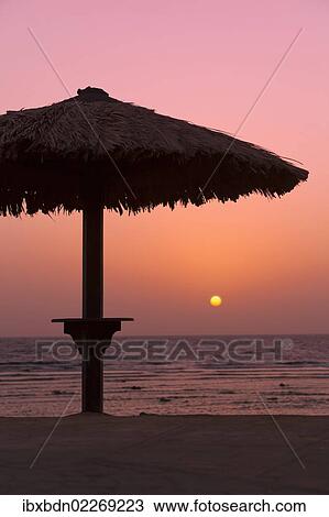 "Sunrise with beach parasol, Dahab, Egypt, Africa" View Large Photo Image Stock Image - "Sunrise with beach parasol, Dahab, Egypt, Africa". Fotosearch