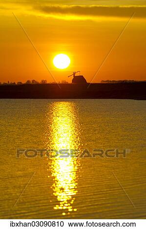 "Sunrise with drawing well at Darscho-Lacke or Warmsee Lake, Seewinkel, Apetlon, Burgenland, Austria, Europe" View Large Photo Image Stock Image - "Sunrise with drawing well at Darscho-Lacke or Warmsee Lake, Seewinkel, Apetlon, Burgenland, Austria, Europe". Fotosearch