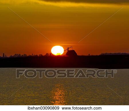 "Sunrise with drawing well at Darscho-Lacke or Warmsee Lake, Seewinkel, Apetlon, Burgenland, Austria, Europe" View Large Photo Image Stock Photo - "Sunrise with drawing well at Darscho-Lacke or Warmsee Lake, Seewinkel, Apetlon, Burgenland, Austria, Europe". Fotosearch