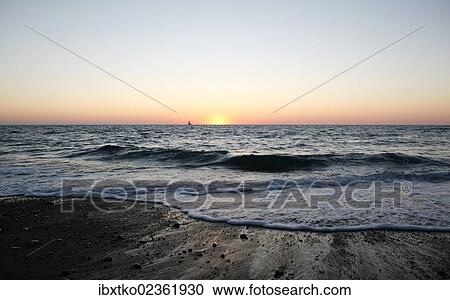Stock Image - "Sunset, Atlantic coast near Saint-Jean-de-Luz, Donibane Lohizune in Basque, Aquitaine region, department of Pyrenees-Atlantiques, France, Europe". Fotosearch