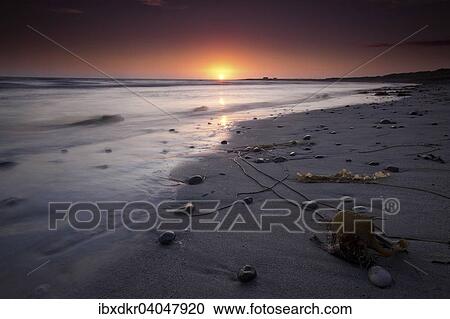 Stock Image - "Sunset, beach, Isle of Barra, Outer Hebrides, Scotland, United Kingdom, Europe". Fotosearch