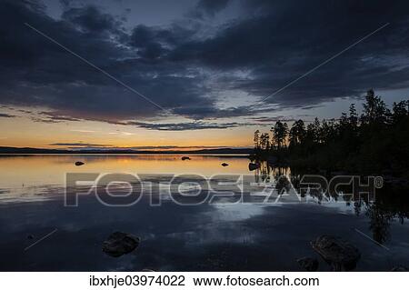 Stock Image - "Sunset, Hamra, Dalarna, Sweden, Europe". Fotosearch