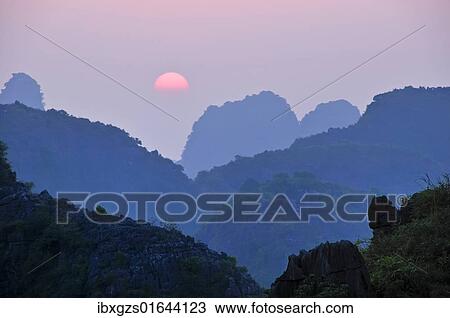 "Sunset in the dry Halong Bay, Ninh Binh area, Vietnam, Southeast Asia, Asia" View Large Photo Image Stock Image - "Sunset in the dry Halong Bay, Ninh Binh area, Vietnam, Southeast Asia, Asia". Fotosearch