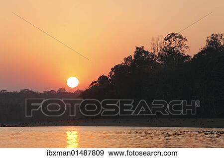 "Sunset, Kabini Reservoir, Rajiv Gandhi National Park, Nagarhole National Park, Karnataka, South India, India, South Asia, Asia" View Large Photo Image Stock Photo - "Sunset, Kabini Reservoir, Rajiv Gandhi National Park, Nagarhole National Park, Karnataka, South India, India, South Asia, Asia". Fotosearch