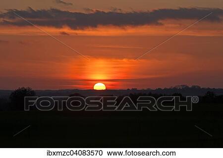 Stock Image - "Sunset, Mecklenburg-Western Pomerania, Germany, Europe". Fotosearch