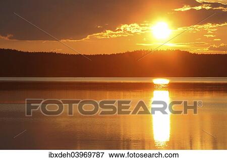 "Sunset on a lake in the Kvikkjokk National Park, Lapland, Sweden, Europe" View Large Photo Image Stock Photo - "Sunset on a lake in the Kvikkjokk National Park, Lapland, Sweden, Europe". Fotosearch