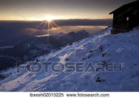"Sunset on Benediktenwand mountain in winter, Benediktbeuern, Bavaria, Germany, Europe" View Large Photo Image Stock Photography - "Sunset on Benediktenwand mountain in winter, Benediktbeuern, Bavaria, Germany, Europe". Fotosearch