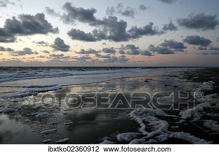 Stock Image - "Sunset on the Atlantic, French Atlantic coast near Saint-Jean-de-Luz, Aquitaine, Departement Pyrenees-Atlantiques, France, Europe". Fotosearch