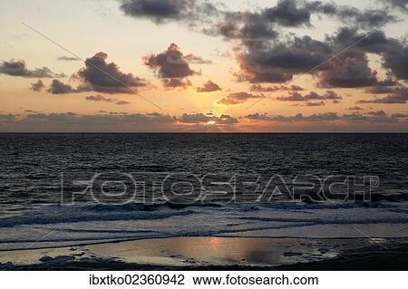 Stock Image - "Sunset on the Atlantic, French Atlantic coast near Saint-Jean-de-Luz, Aquitaine, Departement Pyrenees-Atlantiques, France, Europe". Fotosearch