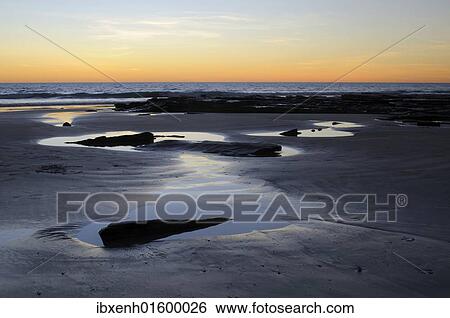 Stock Photograph - "Sunset on the beach in Broome, Australia, Oceania". Fotosearch
