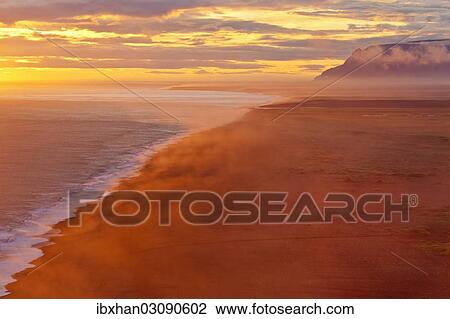 Stock Image - "Sunset on the south coast, Dyrholaey, Vik i Myrdal, Southern Region, Iceland, Europe". Fotosearch