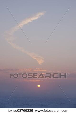 Stock Photograph - "Sunset over a snow-covered meadow, Thuringia, Germany, Europe". Fotosearch
