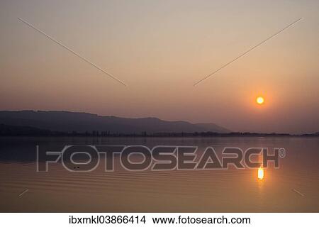 Picture - "Sunset over Lake Constance, near Konstanz, Baden-Wurttemberg, Germany, Europe". Fotosearch