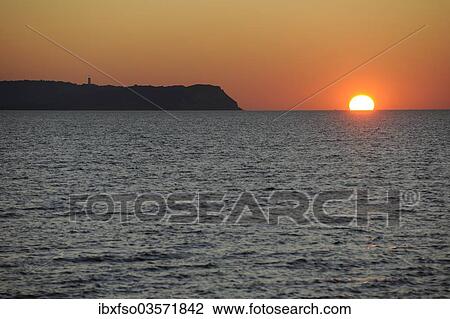 "Sunset over the Baltic Sea beside Hiddensee Island with Dornbusch lighthouse, Hiddensee, Mecklenburg-Vorpommern, Germany, Europe" View Large Photo Image Stock Image - "Sunset over the Baltic Sea beside Hiddensee Island with Dornbusch lighthouse, Hiddensee, Mecklenburg-Vorpommern, Germany, Europe". Fotosearch