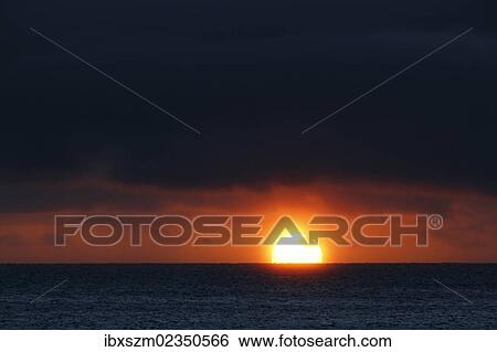 Stock Photograph - "Sunset over the Pacific Ocean, Hawaii, USA". Fotosearch
