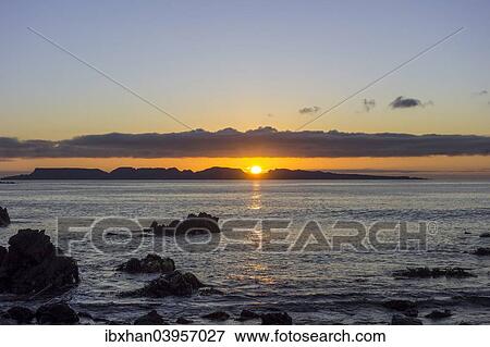 Stock Photo - "Sunset over the sea, Punta de Choros, Coquimbo Region, Chile, South America". Fotosearch
