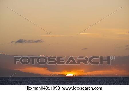 Stock Photo - "Sunset over the sea, Valle Gran Rey, La Gomera, Canary Islands, Spain, Europe". Fotosearch