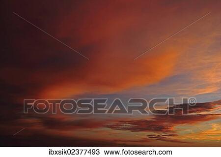 Stock Image - "Sunset, painted sky, evening mood, Upper Swabia, Baden-Wuerttemberg, Germany, Europe". Fotosearch