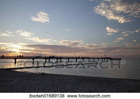 "Sunset, pier, Baltic Sea resort town of Zingst, Mecklenburg-Western Pomerania, Germany, Europe" View Large Photo Image Stock Photo - "Sunset, pier, Baltic Sea resort town of Zingst, Mecklenburg-Western Pomerania, Germany, Europe". Fotosearch