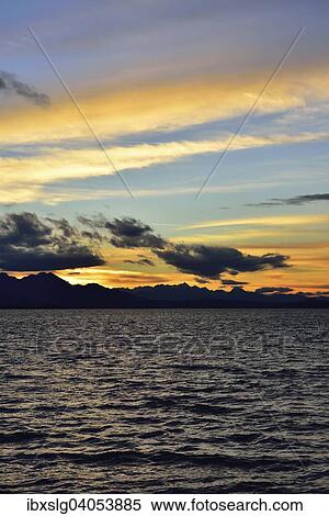 "Sunset with clouds at Lake Chiemsee in Chieming, foothills of the Alps, Chiemgau, Bavaria, Germany, Europe" View Large Photo Image Stock Photography - "Sunset with clouds at Lake Chiemsee in Chieming, foothills of the Alps, Chiemgau, Bavaria, Germany, Europe". Fotosearch
