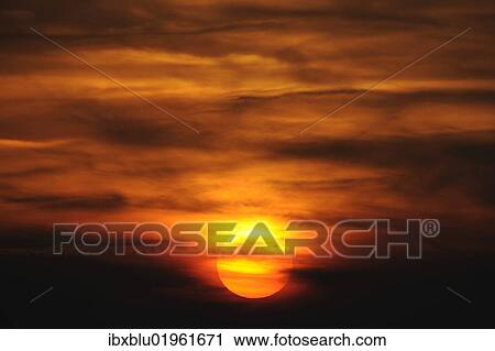 Stock Image - Sunset with clouds. Fotosearch