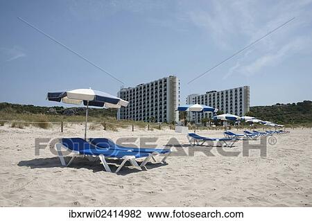"Sunshades and sun loungers on the beach of Son Bou, Menorca, Balearic Islands, Spain, Europe" View Large Photo Image Stock Image - "Sunshades and sun loungers on the beach of Son Bou, Menorca, Balearic Islands, Spain, Europe". Fotosearch