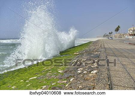 Stock Photo - "Surf at the corniche of Salalah during the monsoon season, or Khareef season, Salalah, Dhofar region, Orient, Oman, Asia". Fotosearch