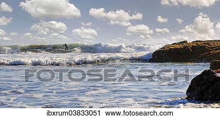 "Surfer in the surf on the Pacific beach near Cambria, California, United States, North America" View Large Photo Image Stock Image - "Surfer in the surf on the Pacific beach near Cambria, California, United States, North America". Fotosearch
