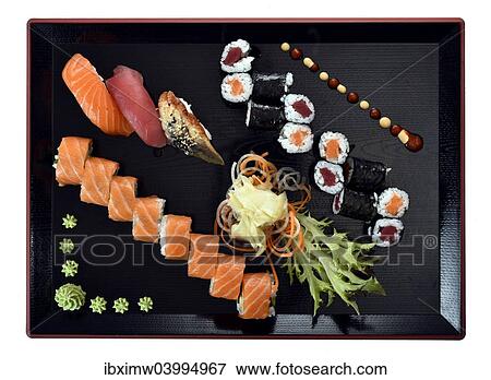 "Sushi dish with Maki, Uramaki, Nigiri with salmon, tuna, eel, fresh ginger, wasabi, on a Japanese wooden plate" View Large Photo Image Stock Photo - "Sushi dish with Maki, Uramaki, Nigiri with salmon, tuna, eel, fresh ginger, wasabi, on a Japanese wooden plate". Fotosearch