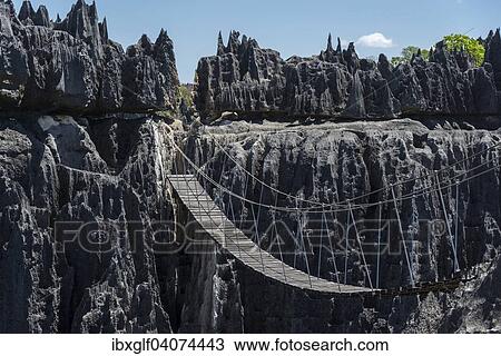 "Suspension bridge over canyon, Karst Landscape, National Park Tsingy du Bemaraha, UNESCO World Heritage Site, Mahajanga, Madagascar, Africa" View Large Photo Image Stock Image - "Suspension bridge over canyon, Karst Landscape, National Park Tsingy du Bemaraha, UNESCO World Heritage Site, Mahajanga, Madagascar, Africa". Fotosearch