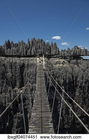 "Suspension bridge over canyon, Karst Landscape, National Park Tsingy du Bemaraha, UNESCO World Heritage Site, Mahajanga, Madagascar, Africa" View Large Photo Image Stock Image - "Suspension bridge over canyon, Karst Landscape, National Park Tsingy du Bemaraha, UNESCO World Heritage Site, Mahajanga, Madagascar, Africa". Fotosearch