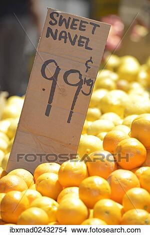 Sweet Navel oranges with a price tag View Large Photo Image Picture - Sweet Navel oranges with a price tag. Fotosearch