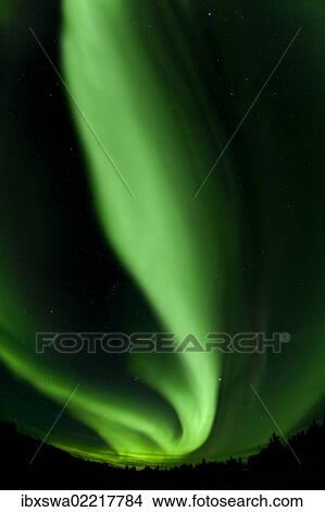 Picture - "Swirling green northern polar lights, Aurora borealis, near Whitehorse, Yukon Territory, Canada, North America". Fotosearch