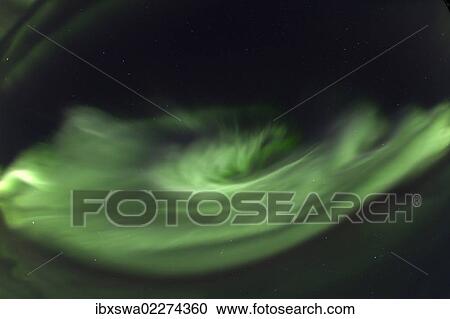 "Swirling northern polar lights, rare overhead display, Aurora Borealis, green, near Whitehorse, Yukon Territory, Canada, North America" View Large Photo Image Stock Image - "Swirling northern polar lights, rare overhead display, Aurora Borealis, green, near Whitehorse, Yukon Territory, Canada, North America". Fotosearch
