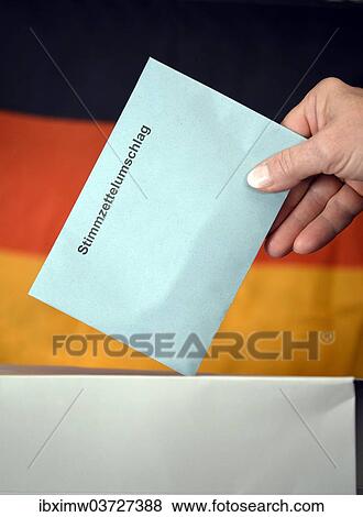 "Symbolic image, elections to the Bundestag, hand putting a ballot envelope into a ballot box, in front of the flag of Germany" View Large Photo Image Stock Photo - "Symbolic image, elections to the Bundestag, hand putting a ballot envelope into a ballot box, in front of the flag of Germany". Fotosearch