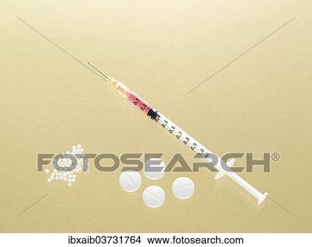 Picture - "Syringe, tablets and globules, various forms of treatment". Fotosearch