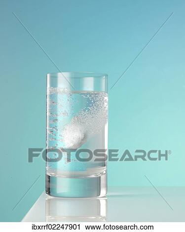 Tablet dissolving in a glass of water View Large Photo Image Stock Image - Tablet dissolving in a glass of water. Fotosearch