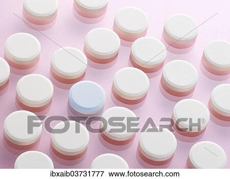 "Tablets, one with a different colour" View Large Photo Image Stock Photo - "Tablets, one with a different colour". Fotosearch