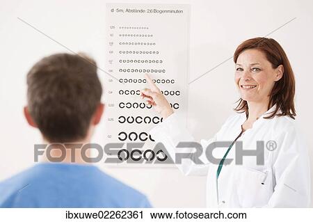 Teenage boy completing an eyesight test with an ophthalmologist View Large Photo Image Stock Image - Teenage boy completing an eyesight test with an ophthalmologist. Fotosearch