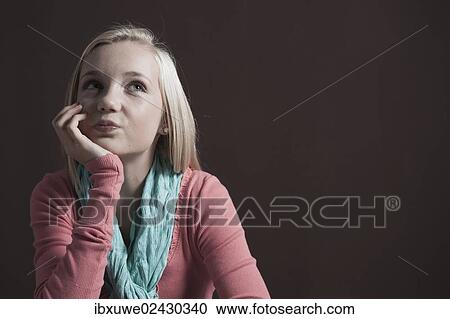 Teenage girl looking pensive View Large Photo Image Stock Image - Teenage girl looking pensive. Fotosearch