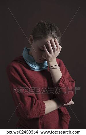 Teenage girl with a thoughtful expression View Large Photo Image Picture - Teenage girl with a thoughtful expression. Fotosearch