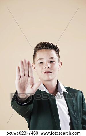 "Teenager in a formal jacket, defensive gesture" View Large Photo Image Stock Image - "Teenager in a formal jacket, defensive gesture". Fotosearch