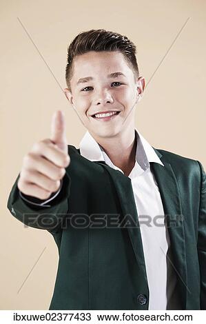 "Teenager in a formal jacket, thumbs up gesture" View Large Photo Image Stock Image - "Teenager in a formal jacket, thumbs up gesture". Fotosearch