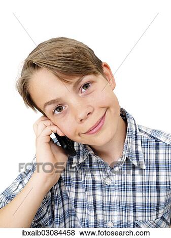 "Teenager using a mobile phone, smiling" View Large Photo Image Stock Photo - "Teenager using a mobile phone, smiling". Fotosearch