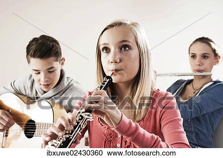Teenagers making music together View Large Photo Image Stock Image - Teenagers making music together. Fotosearch