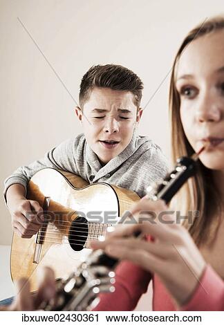 Teenagers making music together View Large Photo Image Stock Image - Teenagers making music together. Fotosearch