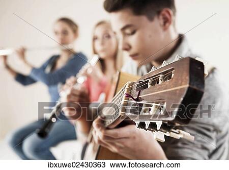 Teenagers making music together View Large Photo Image Stock Image - Teenagers making music together. Fotosearch