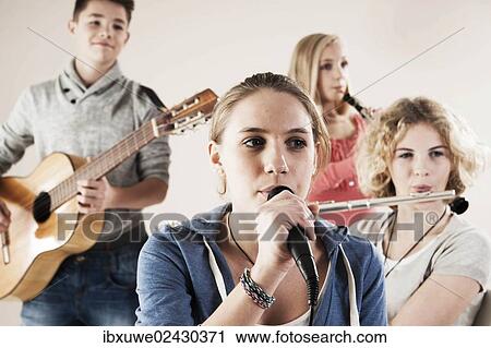 Teenagers making music together View Large Photo Image Stock Image - Teenagers making music together. Fotosearch