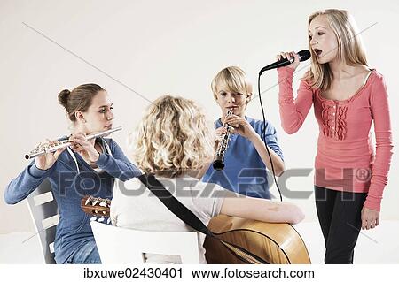 Teenagers making music together View Large Photo Image Stock Image - Teenagers making music together. Fotosearch